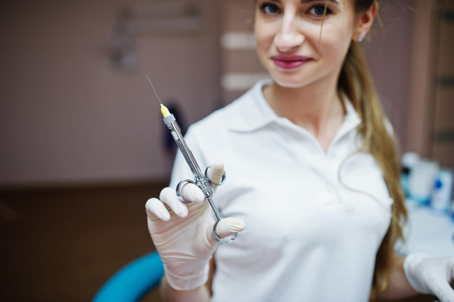 Dental Expertise Female Dentist Posing with Anesthesia Syringe