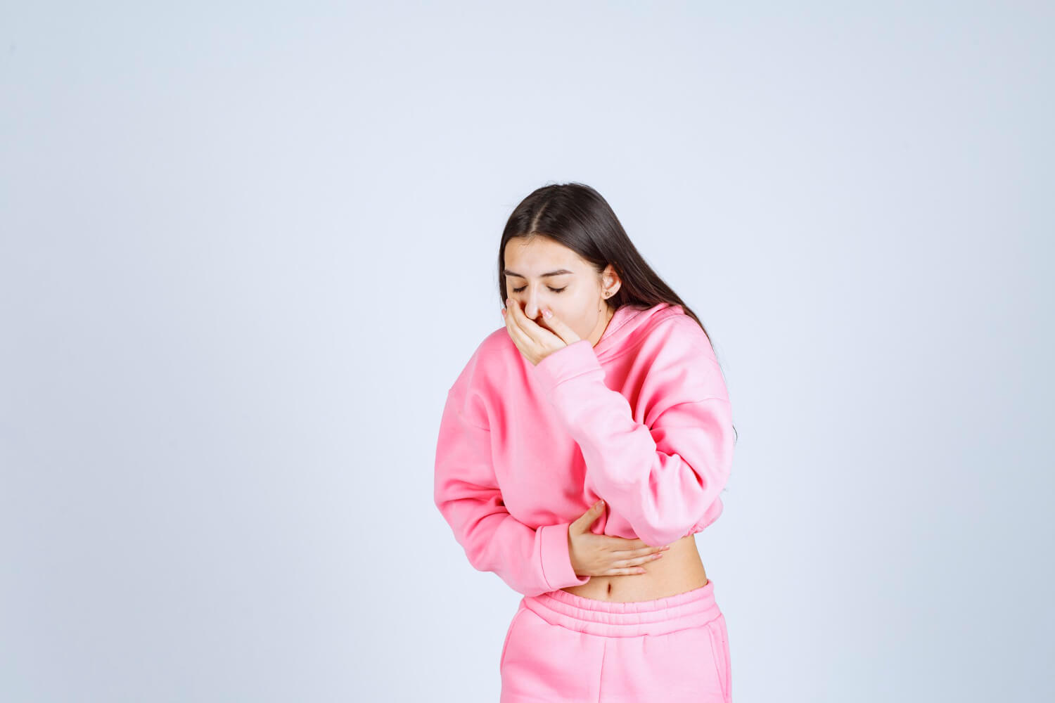 Young woman experiencing nausea or coughing during dental anesthesia