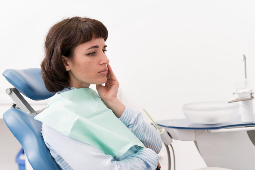 Patient patiently waiting for the effects of anesthesia during a dental procedure