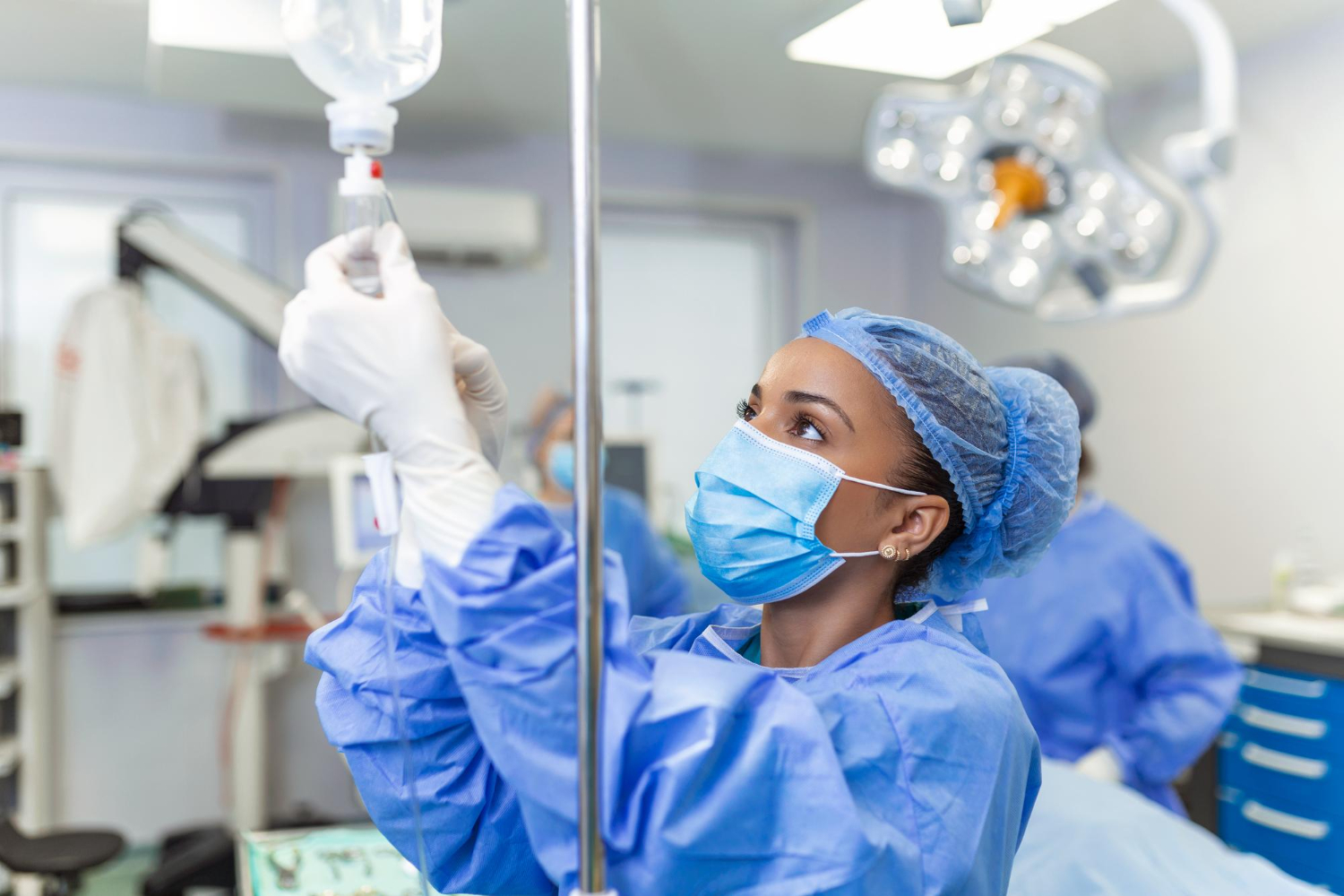 Dentist attentively preparing general anesthesia for sedation