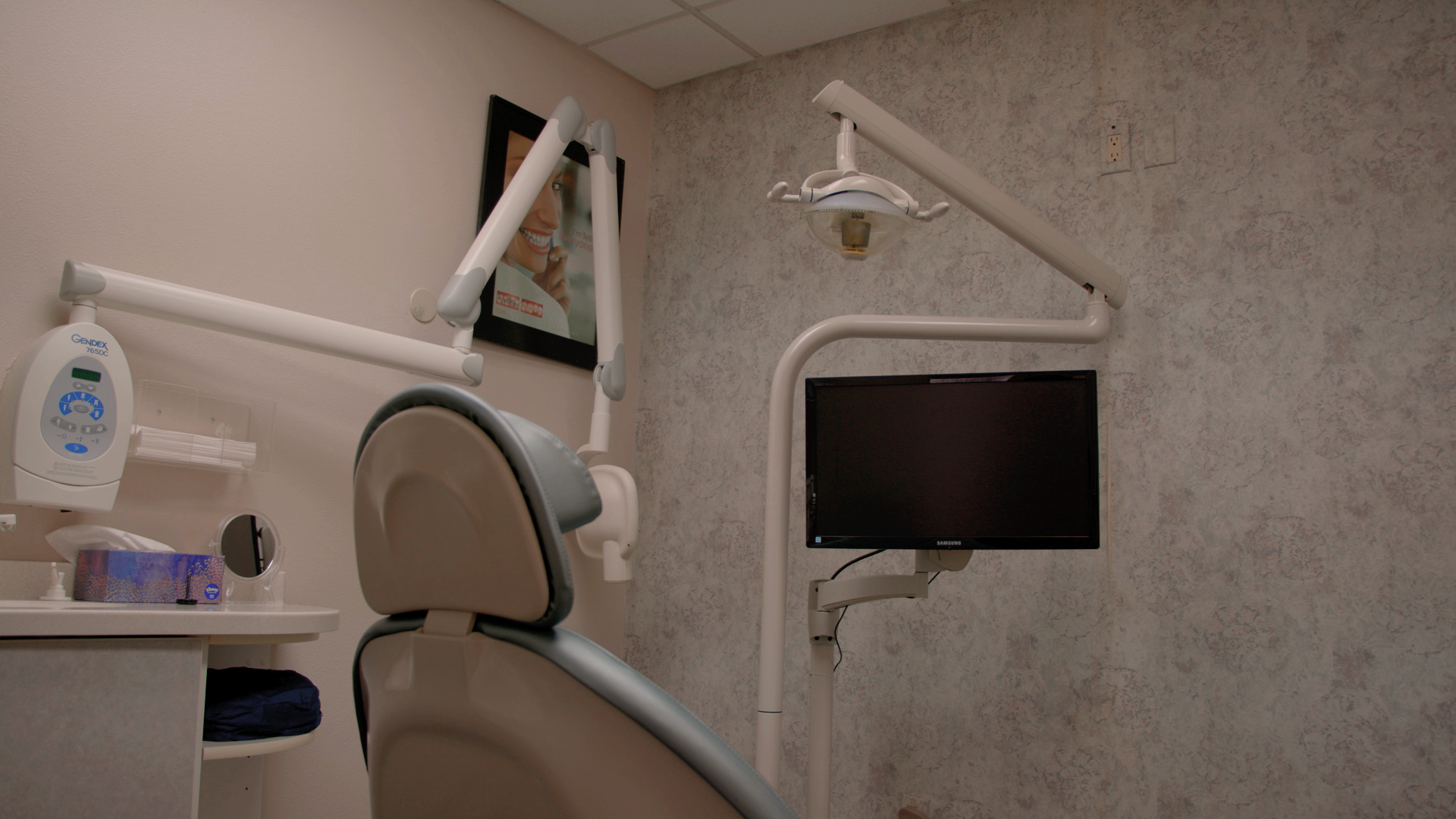 An image showcasing a treatment room at Serena Family & Cosmetic Dentistry, featuring a dental chair and advanced equipment.