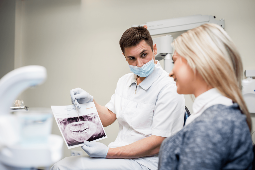 Dentist explaining X-ray to patient